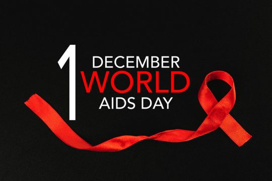 Fond noir avec ruban rouge et inscription Journée mondiale de lutte contre le sida